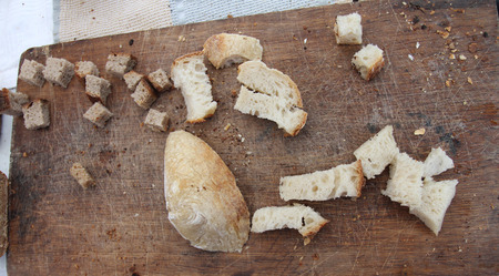 Fresh bread slices on rustic table. Pieces Homemade bread. Chopped Slices of bread . Bread background.の写真素材
