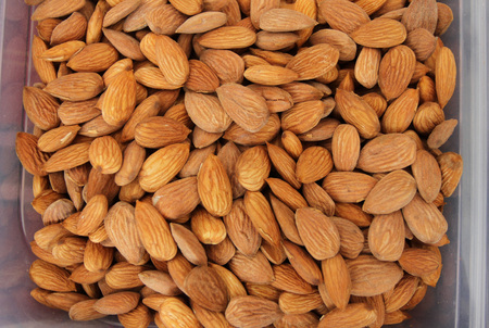 Almonds. Raw fresh organic almond nuts. Almond background. Nuts background. Almond texture and backgroundの写真素材