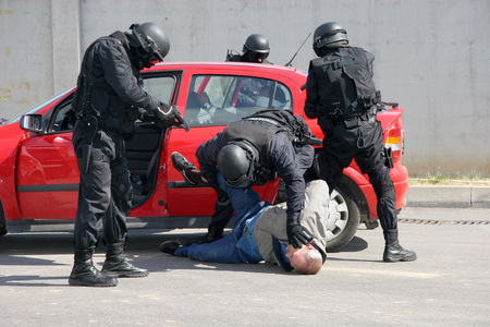 Police squad catch terrorists with car during exercise in the city of Sofia, Bulgaria  sep, 11,2007. Crime scene. Criminals.のeditorial素材