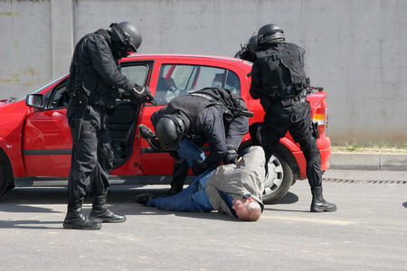 Police squad catch terrorists with car during exercise in the city of Sofia, Bulgaria  sep, 11,2007. Crime scene. Criminals.のeditorial素材