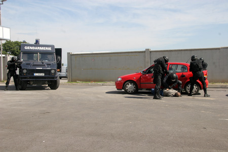 Police squad catch terrorists with car during exercise in the city of Sofia, Bulgaria  sep, 11,2007. Crime scene. Criminals.のeditorial素材