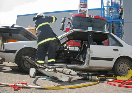 Rescue firefighter in action for saving people from a car crashのeditorial素材