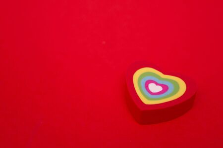 Hearts. Valentine day. Card for St. Valentine day with copy space and hearts. Color hearts on Valentineâs day background. Red background with heart. Group of colored hearts on red background.の写真素材