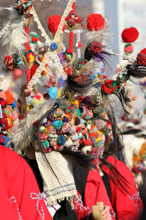Kukeri perform rituals intended to scare away evil spirits during the international festival of masquerade games Surva in Pernik. Mummers dance with costumes and big bells.のeditorial素材