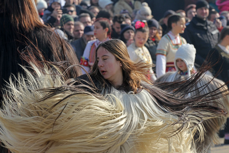 Girls Kukeri, girls mummers perform rituals with costumes and big bells, intended to scare away evil spirits during the international festival  of masquerade games Surva in Pernik, Bulgaria  Jan27,2018. Folkloreのeditorial素材