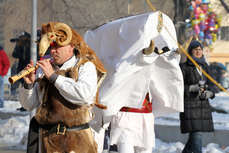 Kukeri, mummers perform rituals with costumes and big bells, intended to scare away evil spirits during the international festival  of masquerade games Surva in Pernik, Bulgaria  Jan27,2018. Folklore ensembleのeditorial素材
