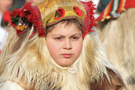 Kukeri , mummers perform rituals intended to scare away evil spirits during the international festival  of masquerade games Surva in Pernik, Bulgaria  Jan27,2018. Mummers walk and dance with costumes and big huge bells.のeditorial素材