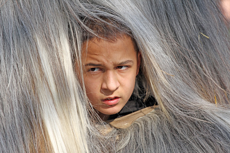 Kukeri , mummers perform rituals intended to scare away evil spirits during the international festival  of masquerade games Surva in Pernik, Bulgaria  Jan27,2018. Mummers walk and dance with costumes and big huge bells.のeditorial素材