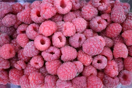 Raspberry. Raspberries background texture. Full frame of fruits. Vitamins and diet concept. Healthy...