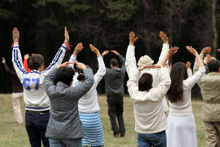 People from White Brotherhood of Peter Deunov dancing paneurithmy dance in the park. Performing...