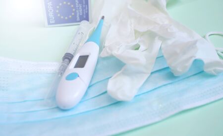 Coronavirus prevention concept. Protective mask, gloves, thermometer, syringe and Europe sign.