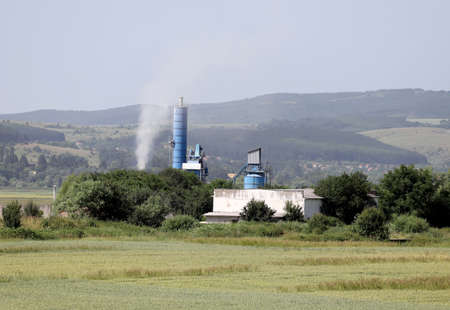 Thermal power plant (TPP) Bobov dol with illegal burning of waste on june, 2021. TEC or TETs Bobov dol with high air pollution on a blue sky. RDFの写真素材