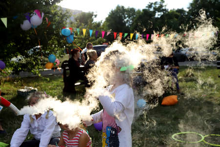 Children's birthday party with tricks and smoke from dry ice.の写真素材