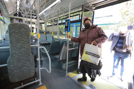 People are wearing protective mask while traveling by public transport (bus) in Sofia, Bulgaria on Nov 01, 2021のeditorial素材