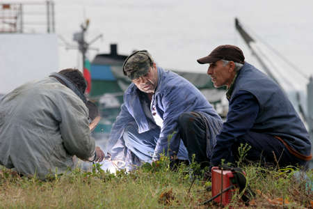 A welder welds and repair machine parts outdoor.のeditorial素材