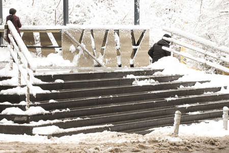 Snowy and icy stairs in front deli.の写真素材
