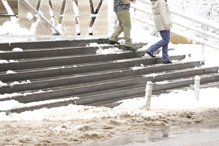 Snowy and icy stairs in front deli.の写真素材