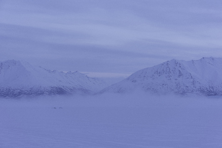 Fog and mountains in Alaskaの写真素材