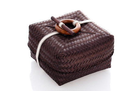 brown wicker box, on a white,  backgroundの写真素材