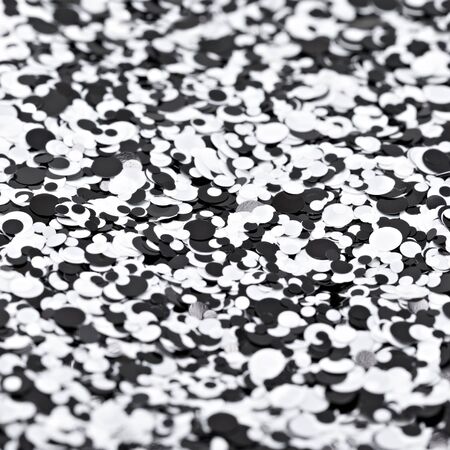 black and white shiny texture, sequins with blur background.の写真素材