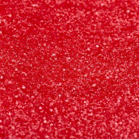 red shiny texture, sequins with blur background.の写真素材