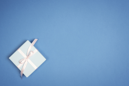 Christmas  holiday gift box  on blue background. Flat lay.の写真素材