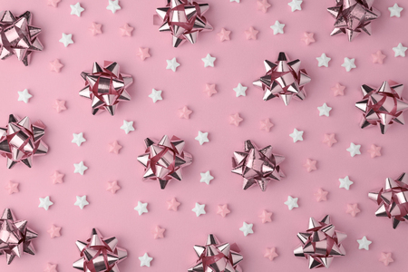Christmas snowflake  with   sweets candy flat lay on pink pastel  background. Minimal concept.の写真素材