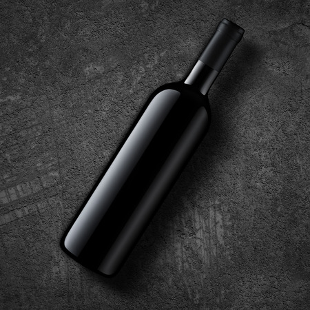 A wine bottle   on dark grey concrete background.   Top view.の写真素材
