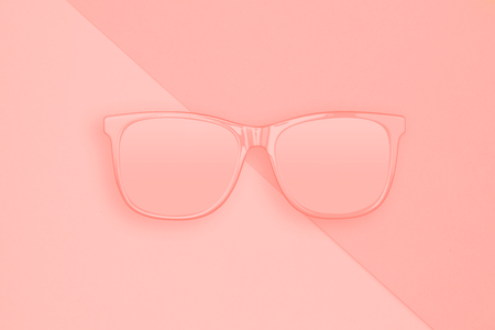 Creative layout made of sunglasses on pastel pink and coral color background. Summer concept. Sunglasses mockup as design element vacation and journeys top view. Minimal concept.の写真素材