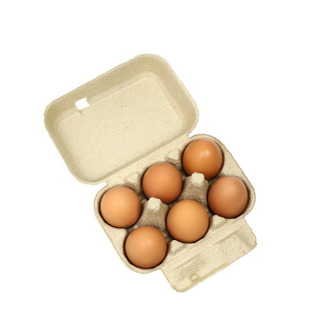Six brown eggs in a carton package isolated with clipping path