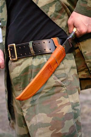 Knife on a belt of the man  の写真素材