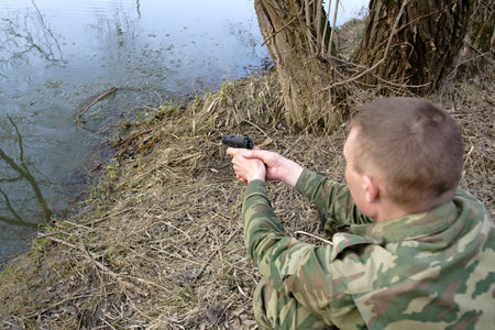 The man trains to shoot from a pistolの写真素材