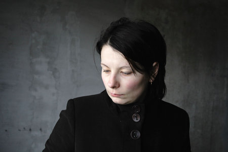 The girl in black thinks of the past の写真素材