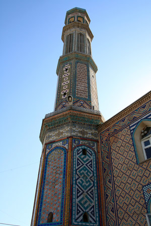 The prayer tower at summer on the sky background