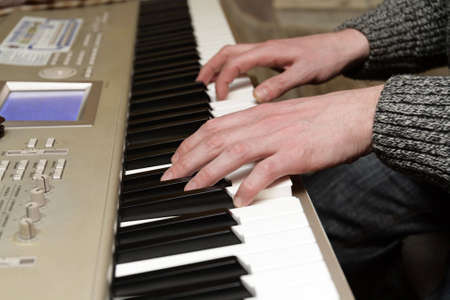 Playing the digital piano in the evening