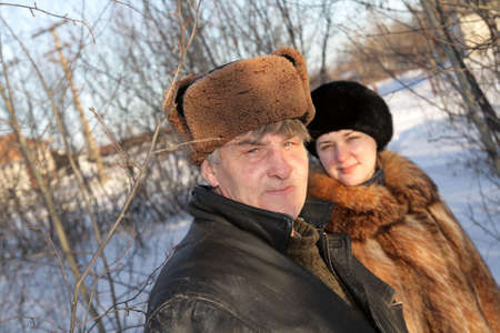 Man and woman on the winter walkの写真素材