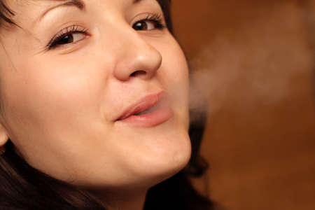 The portrait of the smoking girl, indoor