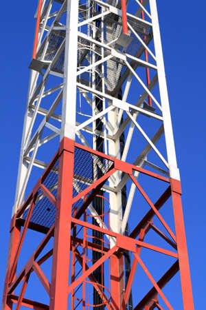 The fragment of telecom tower at the sky background