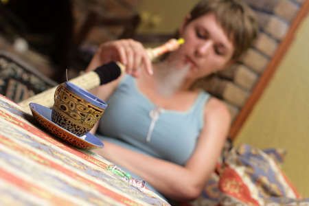 The girl with hookah in a chaikhanaの写真素材