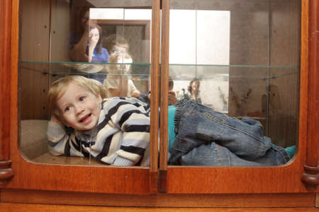 The smiling child in a built-in closetの写真素材