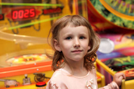 Portrait of girl in a game room の写真素材