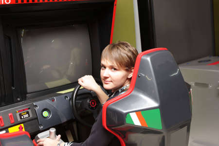 The girl playing in a game room