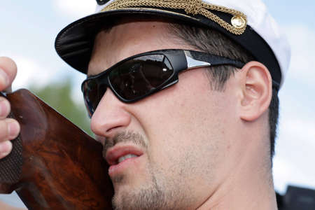 Portrait of a shooting rifleman in summer