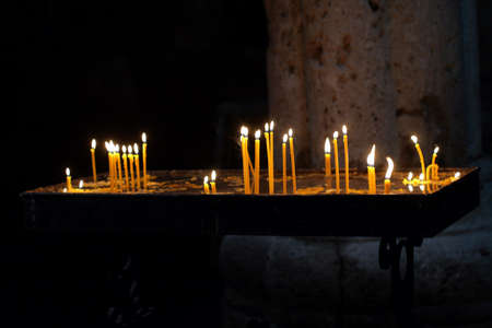 Inside of armenian apostolic church, burning candlesの写真素材