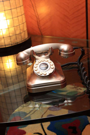 The retro metallic telephone in a hotelの写真素材