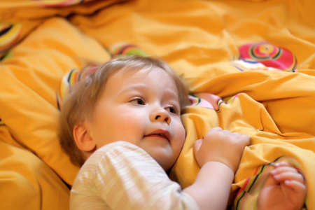 The little boy goes to sleep at homeの写真素材