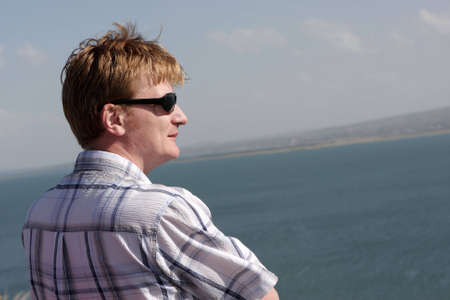 The man looks at Sevan in Armeniaの写真素材