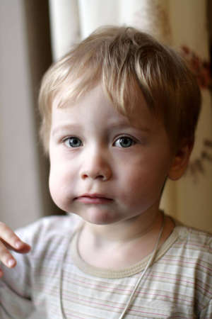 The little boy has a breakfast at homeの写真素材