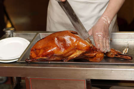 Preparation of Peking Duck. Peking Roast Duck is a famous duck dish from Beijing that has been prepared since the imperial era, and is now considered one of China's national foods.の写真素材