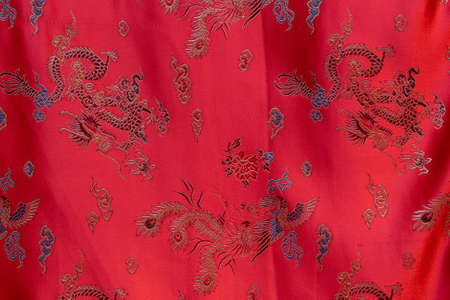 Red silk bedsheet in a shop as backgroundの写真素材